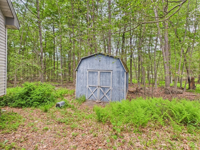114 Oswayo Dr, Pocono Lake, PA 18347 - view of shed featuring a forest view