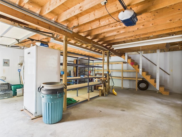 114 Oswayo Dr, Pocono Lake, PA 18347 - basement featuring freestanding refrigerator, stairs, and electric panel