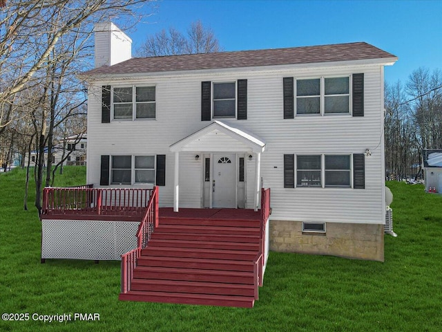 colonial home with a chimney and a front lawn