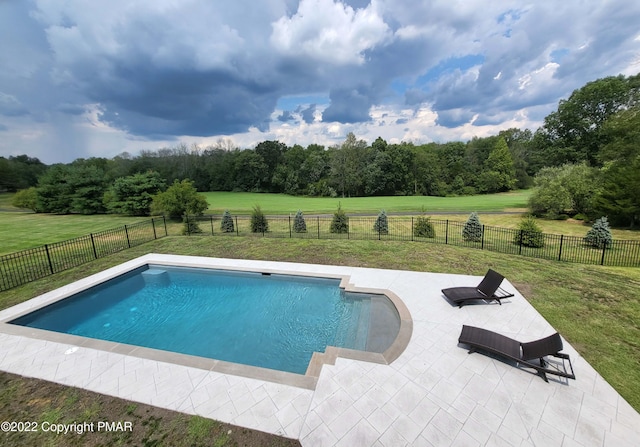 view of pool with a fenced in pool, a patio area, a yard, and a fenced backyard