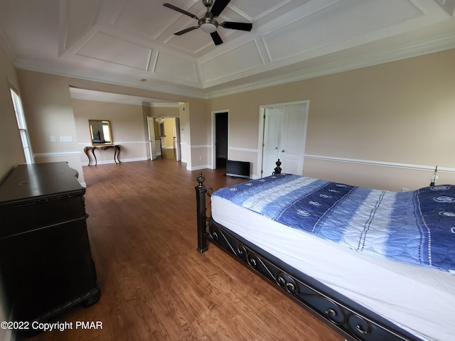 bedroom with ornamental molding, a ceiling fan, wood finished floors, coffered ceiling, and baseboards