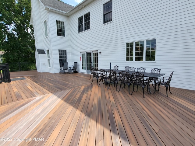 wooden deck with outdoor dining area