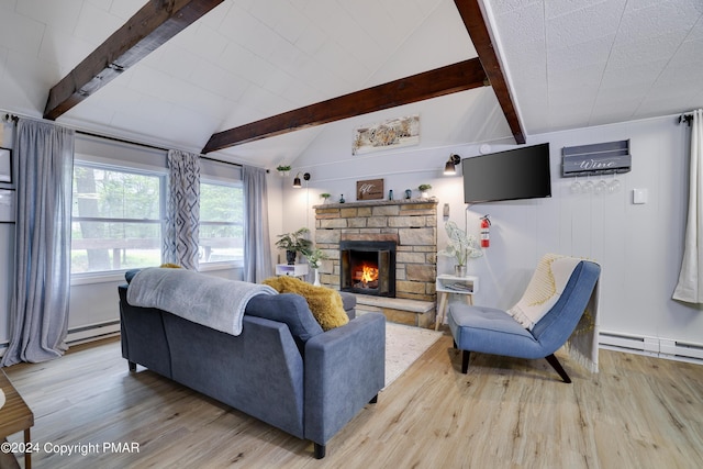 living room featuring lofted ceiling with beams, light wood-style flooring, a fireplace, and a baseboard radiator