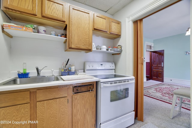 kitchen with electric range, a drop ceiling, light countertops, open shelves, and a sink