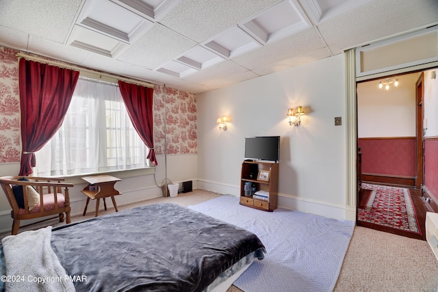 bedroom featuring carpet, a wainscoted wall, and baseboards