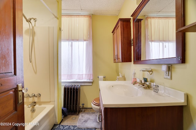 full bath with a paneled ceiling, radiator, toilet, vanity, and shower / tub combination