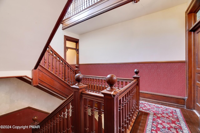 stairway featuring hardwood / wood-style flooring