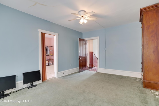 unfurnished bedroom featuring carpet flooring, ceiling fan, and baseboards