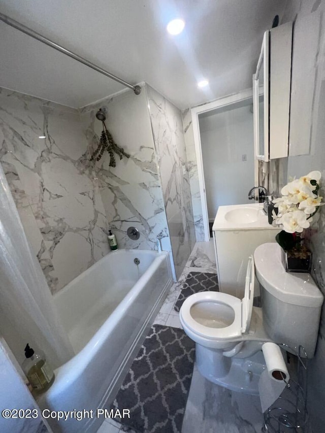 bathroom with vanity, toilet, tub / shower combination, and marble finish floor