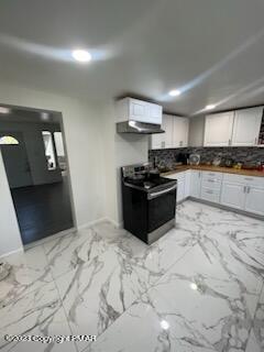 kitchen with ventilation hood, decorative backsplash, white cabinets, electric range, and marble finish floor