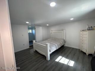 bedroom featuring recessed lighting, wood finished floors, and baseboards