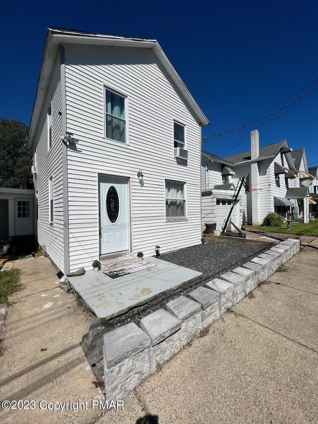 view of front of property featuring cooling unit