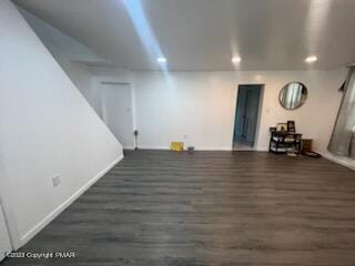 basement with recessed lighting, baseboards, and wood finished floors