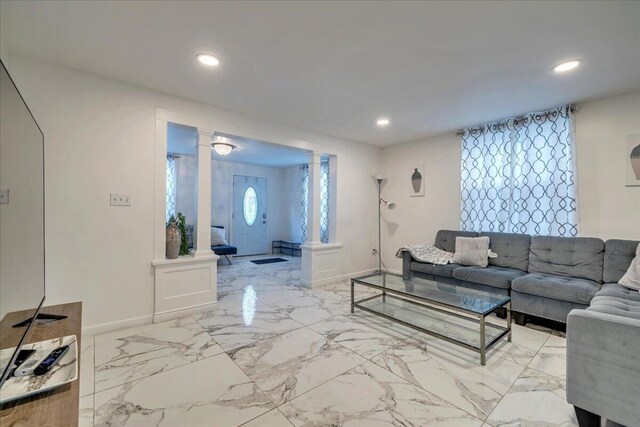 kitchen featuring baseboards, recessed lighting, freestanding refrigerator, marble finish floor, and baseboard heating