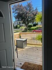 doorway featuring wood finished floors