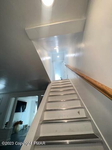 stairs featuring baseboards