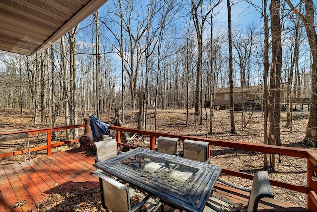 wooden terrace featuring outdoor dining space