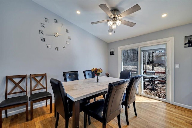 dining room with light wood-type flooring, recessed lighting, baseboards, lofted ceiling, and ceiling fan