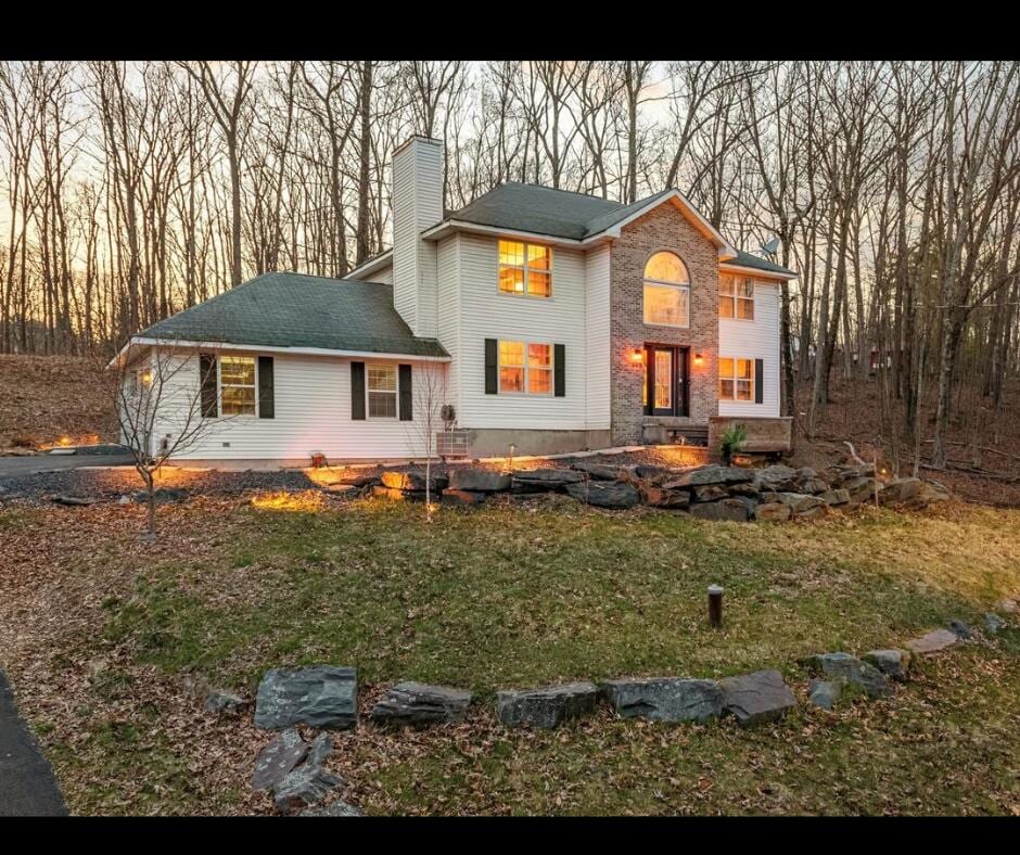 145 Marcelle Ter, Tannersville, PA 18372 - back of house featuring a yard and a chimney