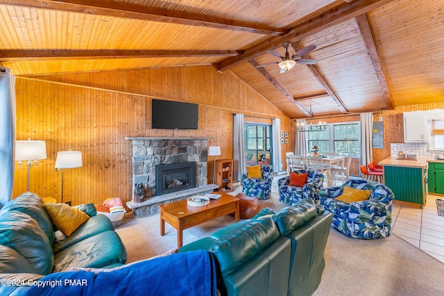 living area featuring wooden ceiling, tile patterned floors, vaulted ceiling with beams, a stone fireplace, and wood walls