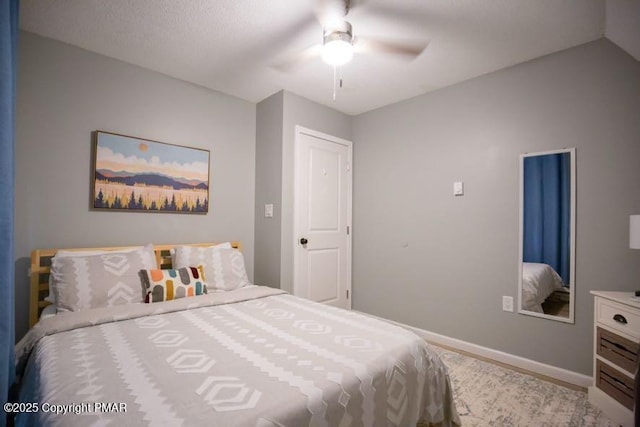 bedroom featuring a ceiling fan and baseboards