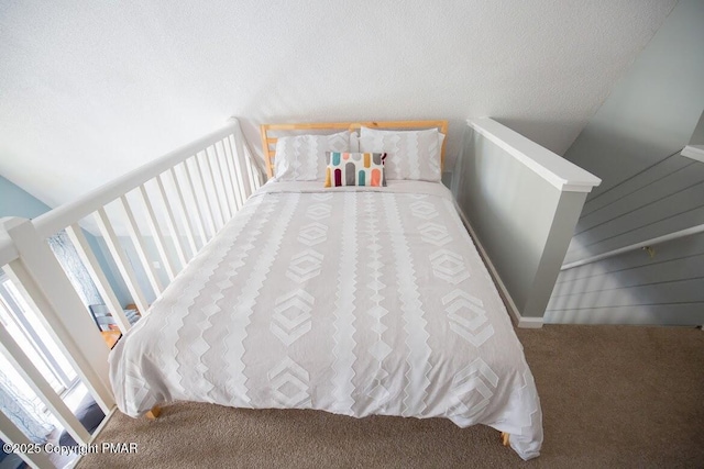 carpeted bedroom with a textured ceiling