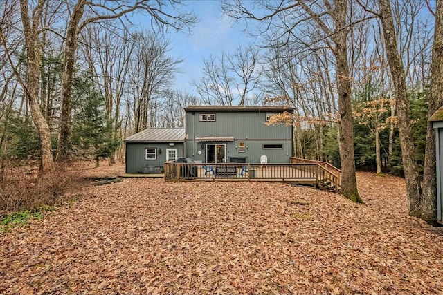 view of front of property with metal roof and a deck