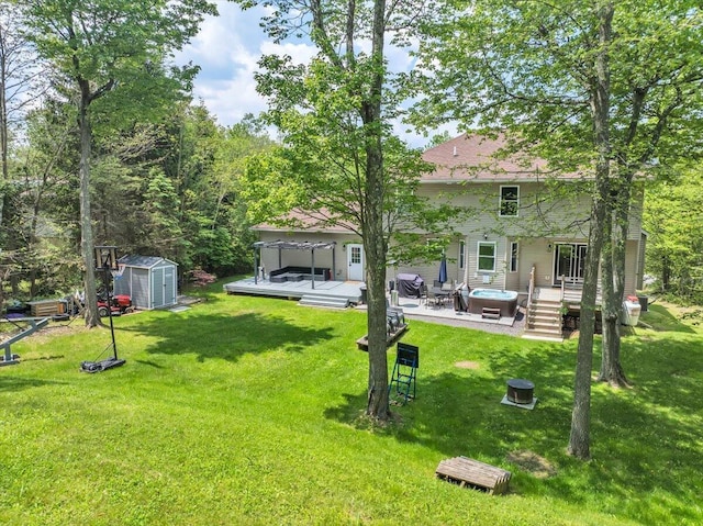 3336 Buck Run, Tobyhanna, PA 18466 - view of green lawn with a hot tub, a shed, a patio, and a wooden deck