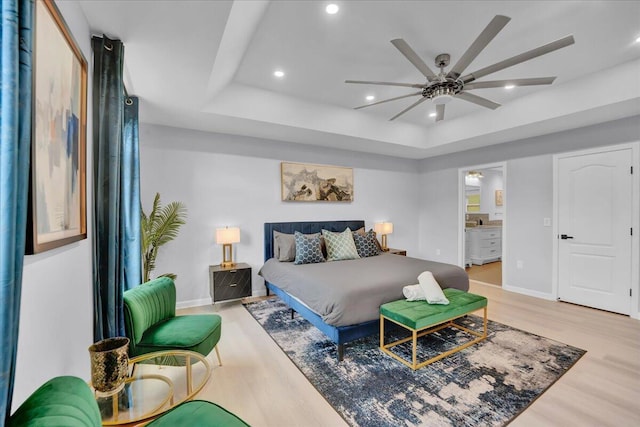 3336 Buck Run, Tobyhanna, PA 18466 - bedroom featuring light wood-type flooring, recessed lighting, a raised ceiling, ensuite bathroom, and ceiling fan