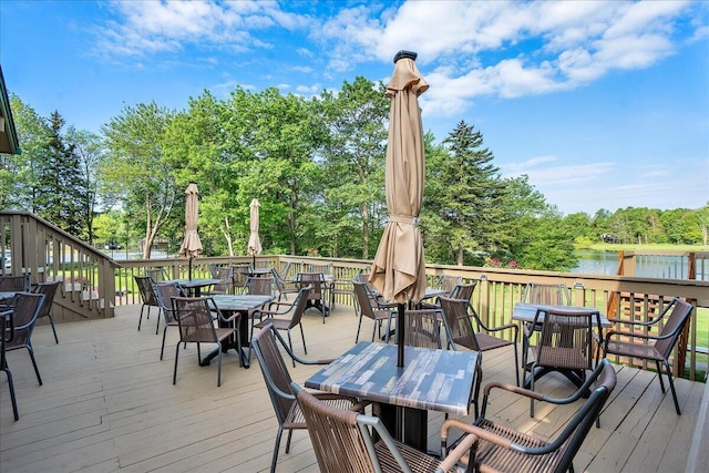 3336 Buck Run, Tobyhanna, PA 18466 - deck featuring outdoor dining space, a water view, and view of scattered trees