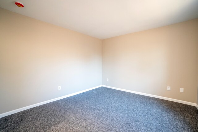 663 Sullivan Trl, Long Pond, PA 18334 - unfurnished room featuring dark carpet and baseboards