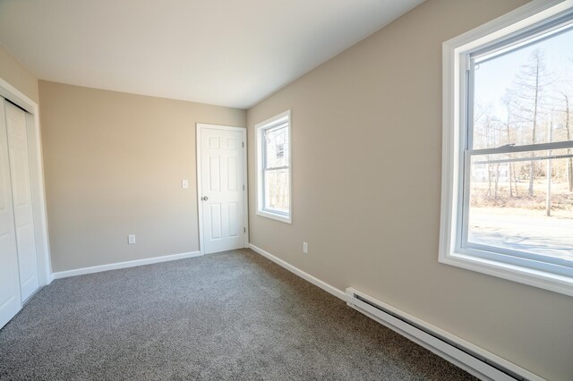 663 Sullivan Trl, Long Pond, PA 18334 - unfurnished bedroom with a baseboard radiator, baseboards, carpet flooring, and a closet