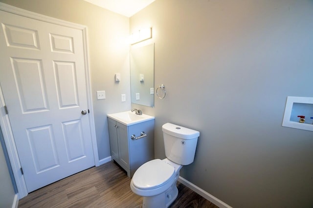 663 Sullivan Trl, Long Pond, PA 18334 - bathroom with wood finished floors, vanity, toilet, and baseboards