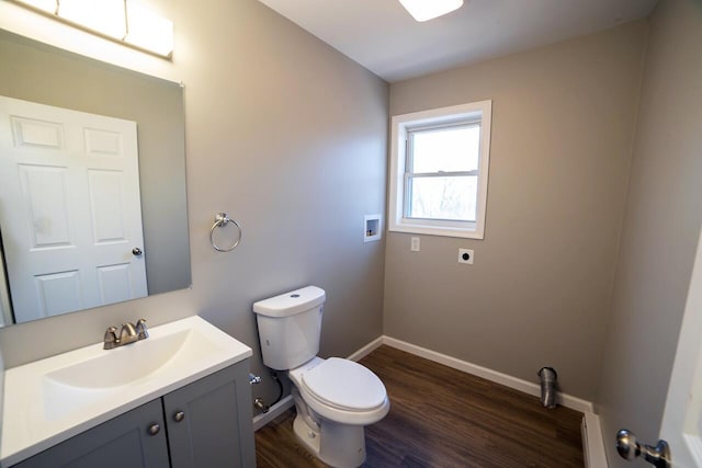 663 Sullivan Trl, Long Pond, PA 18334 - bathroom featuring toilet, vanity, wood finished floors, baseboards, and a baseboard radiator