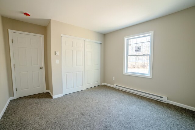 663 Sullivan Trl, Long Pond, PA 18334 - unfurnished bedroom with a baseboard radiator, carpet, a closet, and baseboards