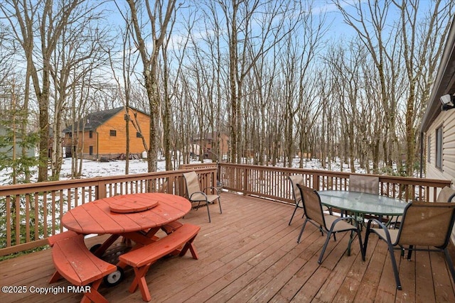 view of snow covered deck