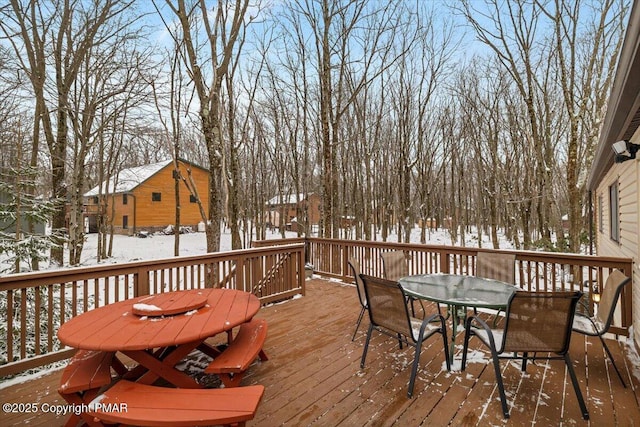 view of snow covered deck