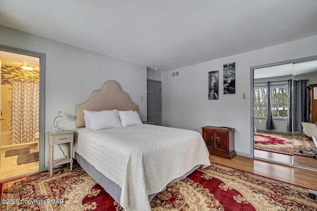 bedroom featuring hardwood / wood-style floors