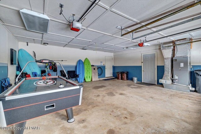 garage featuring a garage door opener and electric panel