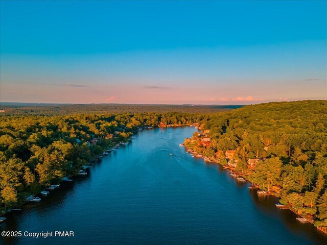 aerial view at dusk with a water view