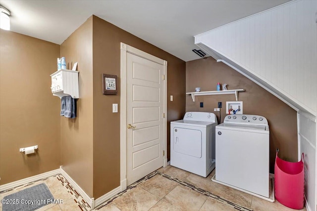 washroom featuring washing machine and dryer