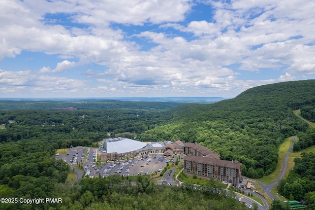 aerial view featuring a forest view