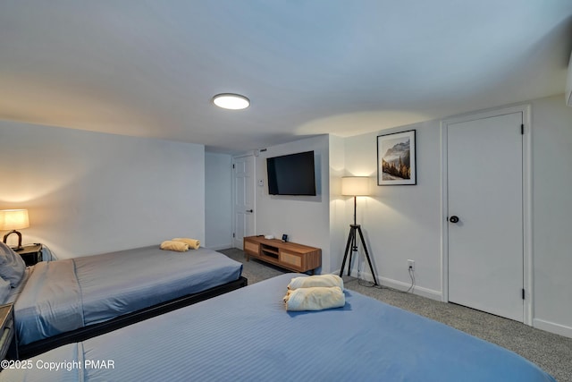 bedroom featuring carpet and baseboards