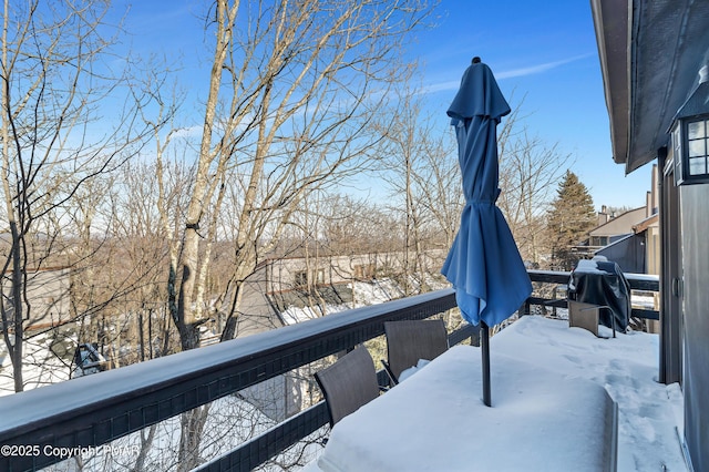 snow covered deck with grilling area