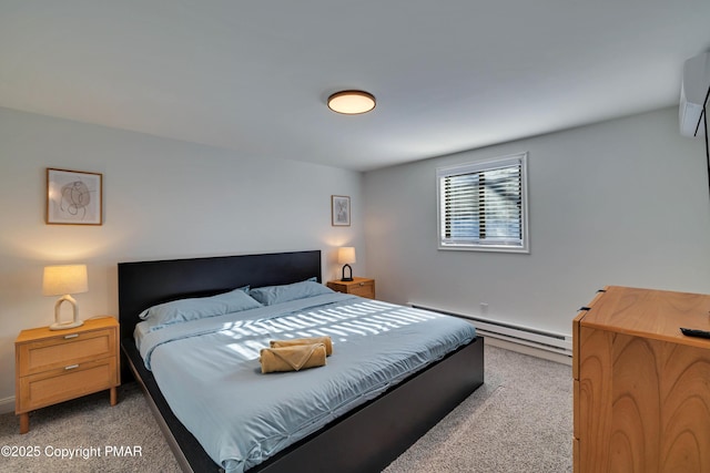 bedroom with a baseboard heating unit and light colored carpet