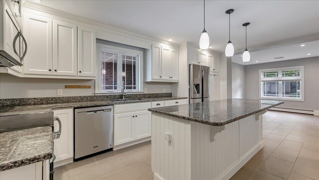 2705 W Gordon St, Allentown, PA 18104 - kitchen featuring appliances with stainless steel finishes, a baseboard heating unit, white cabinetry, light tile patterned floors, and recessed lighting