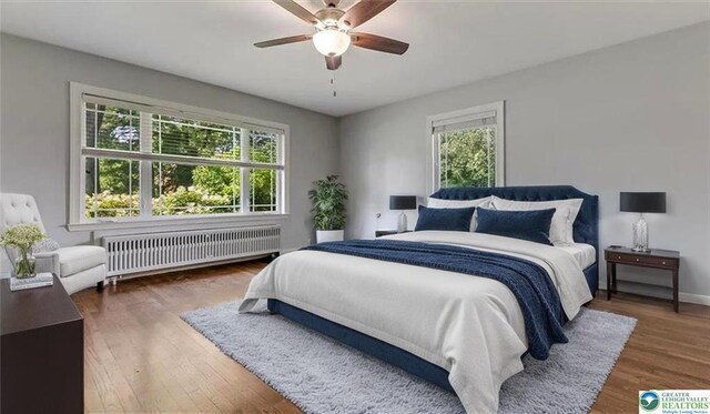 2705 W Gordon St, Allentown, PA 18104 - bedroom with radiator, wood finished floors, and ceiling fan