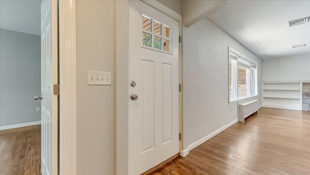 2705 W Gordon St, Allentown, PA 18104 - entryway featuring wood finished floors and radiator heating unit