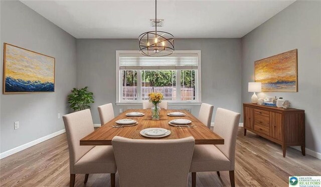 2705 W Gordon St, Allentown, PA 18104 - dining area featuring light wood finished floors and a chandelier
