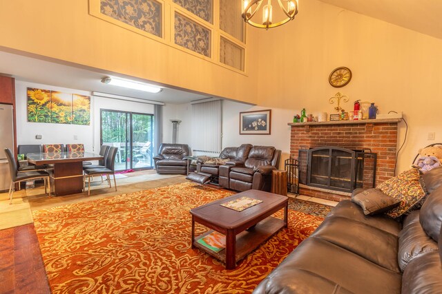 88 Wild Turkey Cir, Lake Ariel, PA 18436 - living room with a towering ceiling, a chandelier, and a fireplace